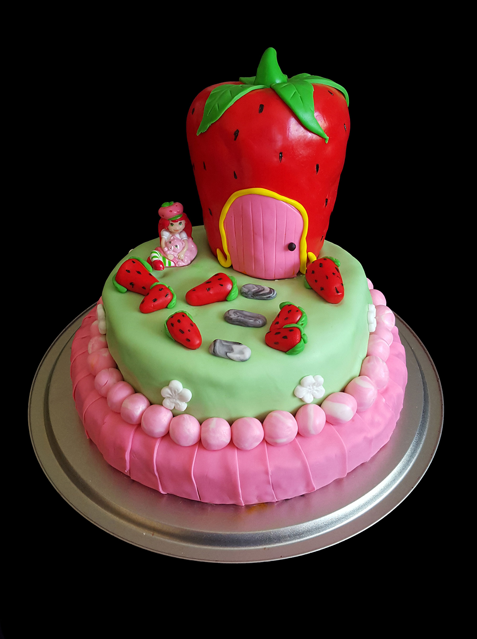 birthday cake on the theme of strawberry shortcake with strawberry house